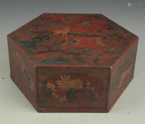 A GILT LACQUER FLOWER PAINTED HEXAGONAL BOX