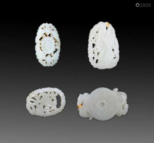 GROUP OF FOUR FINELY CARVED JADE PENDANT