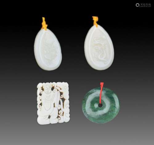 GROUP OF FOUR FINELY CARVED JADE PENDANT