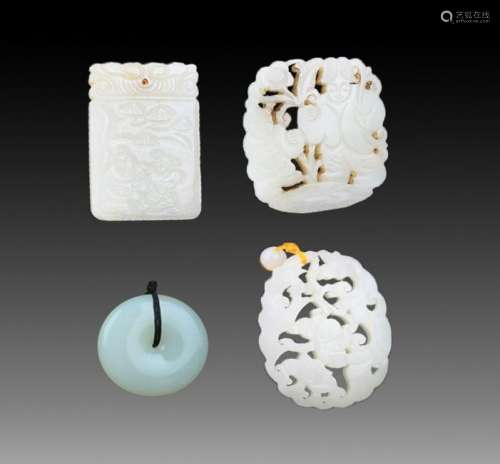 GROUP OF FOUR FINELY CARVED JADE PENDANT