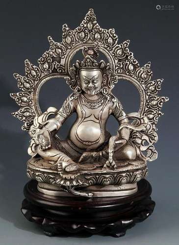 A FINELY CARVED DZAMABALA BUDDHA FIGURE