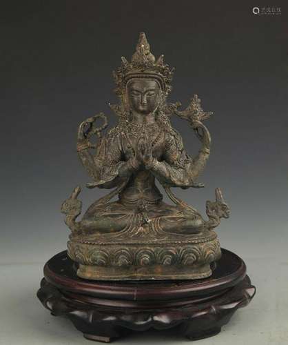 A FINE BRONZE TIBETAN FOUR ARMS GUAN YIN BUDDHA