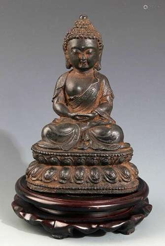 A FINELY CARVED IRON MADE AKSHOBHYA BUDDHA