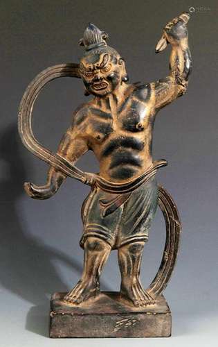 A FINELY CARVED BRONZE DEITY FIGURE