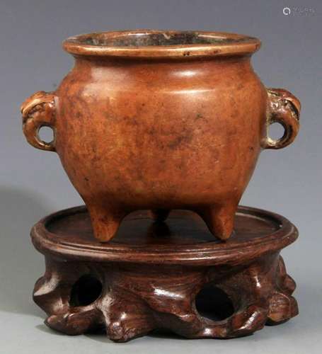 AN ELEPHANT EAR BRONZE CENSER