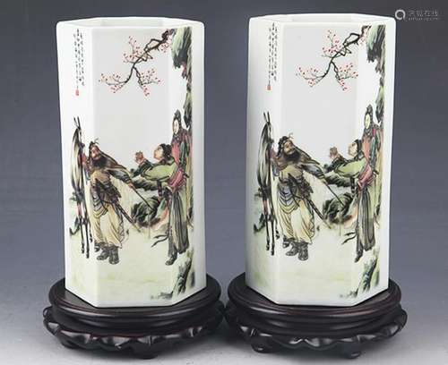 A PAIR OF STORY PAINTED PORCELAIN BRUSH POT