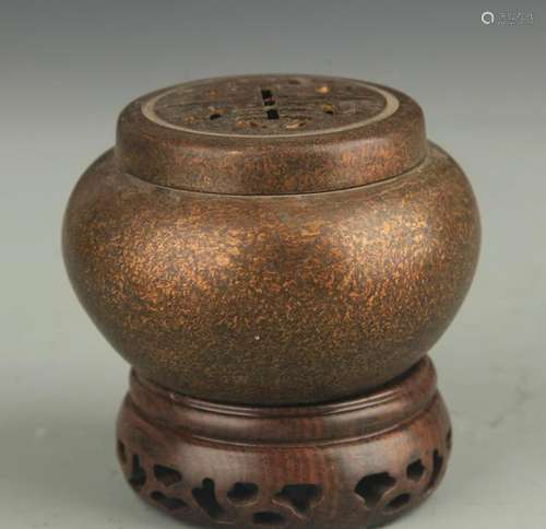 A FINELY CARVED ROUND BRONZE AROMATHERAPY BURNER