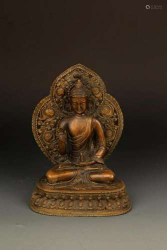 A FINELY CARVED TATHAGATA FIGURE WITH HALO