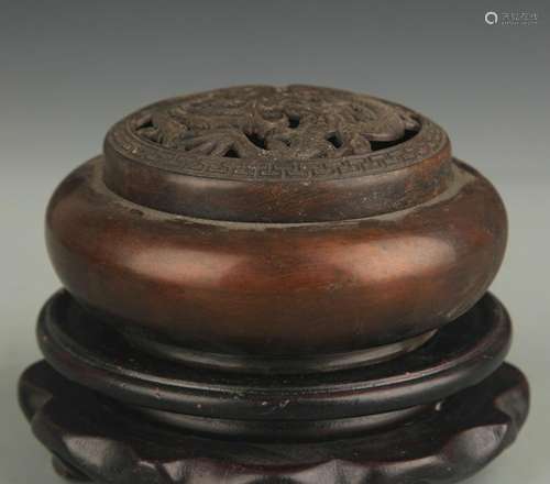 A BRONZE ROUND AROMATHERAPY BURNER