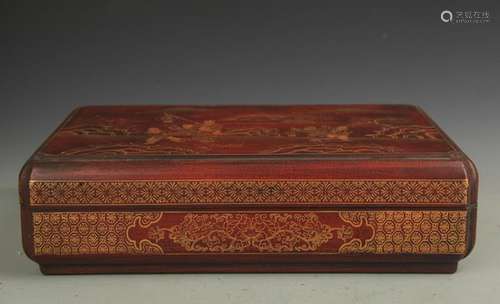 A GILT LACQUERED WOOD BOY PLAY INCHG BOX WITH COVER