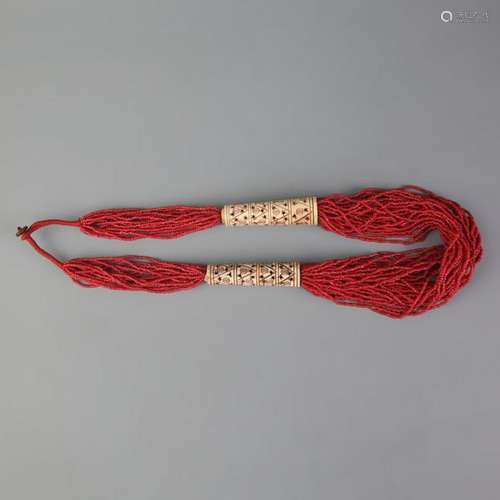 A FINE CORAL AND OX BONE NECKLACE