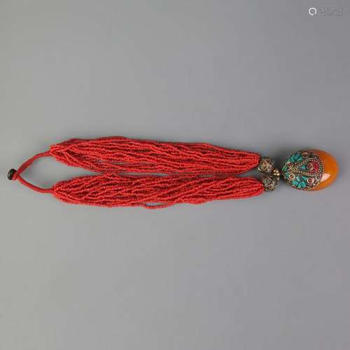 A FINE CORAL AND BEESWAX NECKLACE