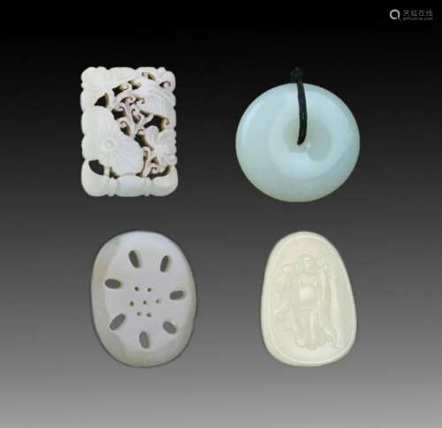 GROUP OF FOUR FINELY CARVED JADE PENDANT
