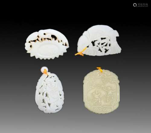 GROUP OF FOUR FINELY CARVED JADE PENDANT