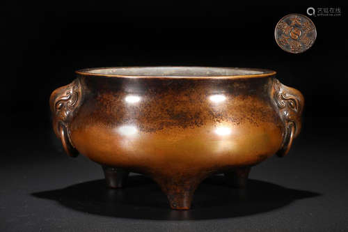 A BRONZE TRIPOD CENSER