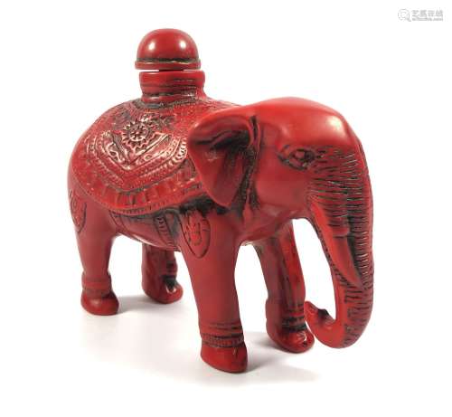 AN ORIENTAL CORAL TYPE RED ELEPHANT SNUFF BOTTLE