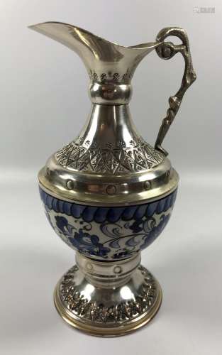 A CHINESE BLUE AND WHITE EWER WITH WHITE METAL MOUNTS