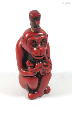 AN ORIENTAL CORAL TYPE RED MONKEY SNUFF BOTTLE