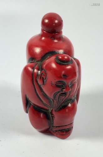 AN ORIENTAL CORAL TYPE RED FIGURAL SNUFF BOTTLE