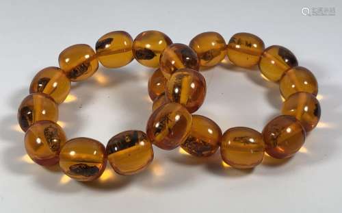 TWO AMBER TYPE ORIENTAL INSECT BRACELETS
