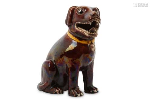 A CHINESE RED-GLAZED MODEL OF A DOG.