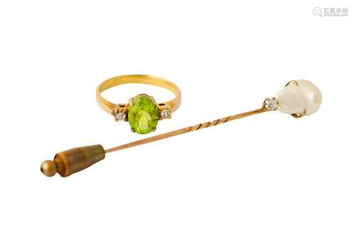 A peridot ring and a pearl and diamond stickpin