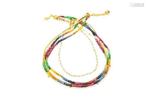 A multistrand gem-set necklace