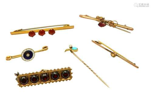 A collection of bar brooches