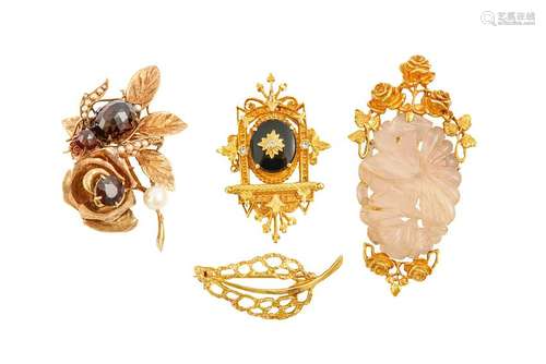 A group of four brooches