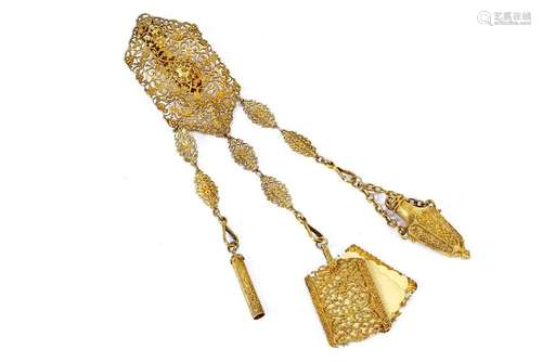 A mid-19th century gilt metal chatelaine, probably