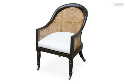 A pair of 19th Century ebonised bergere arm chairs