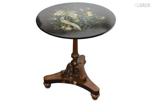 A decorative circular snap top occasional table