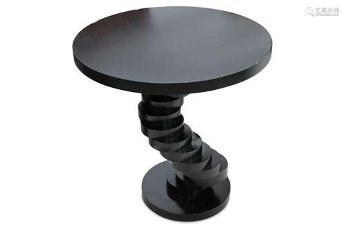 A contemporary ebonised circular side table