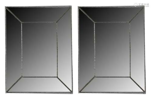 A large pair of contemporary rectangular wall mirrors