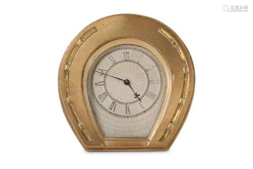 A 20th century brass strut clock in the form of a