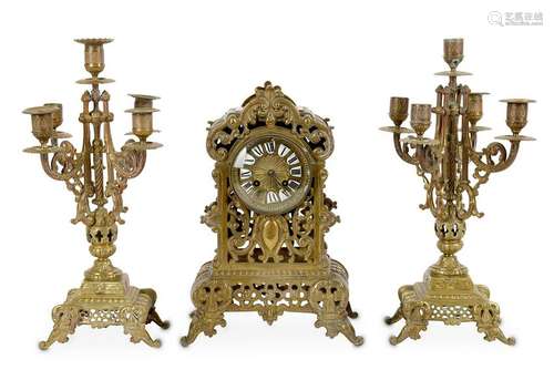 A French brass clock garniture, with striking movement,