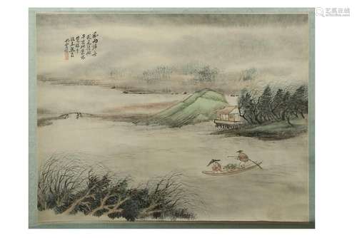 A Chinese landscape painting mounted on a hanging