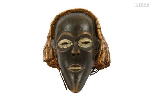 A FRINGED WOOD MASK