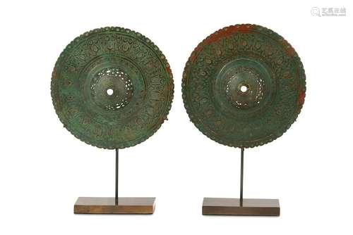 TWO PIERCED AND ENGRAVED BRONZE BOSSES