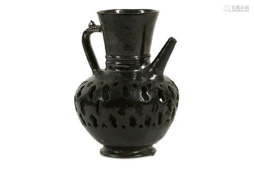 A BLACK-GLAZED PIERCED POTTERY EWER