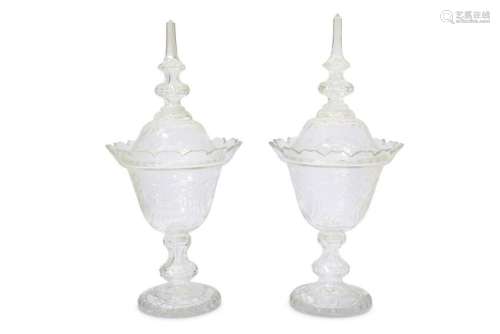 A pair of 19th Century Bohemian glass jars and covers