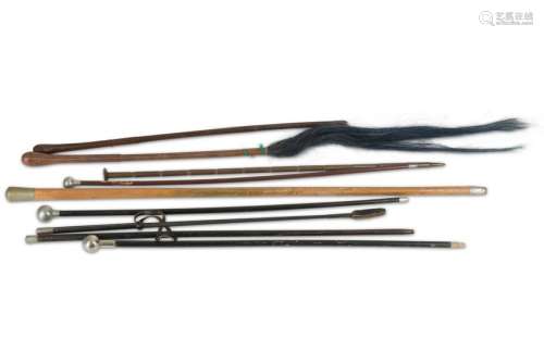 A collection of nine military walking sticks and