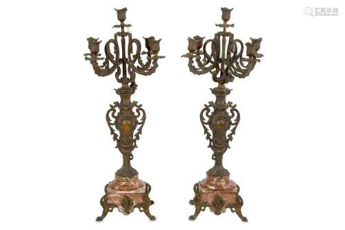 A pair of rouge marble based spelter five light