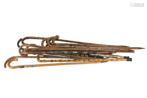 A quantity of novelty Alpine walking sticks, each