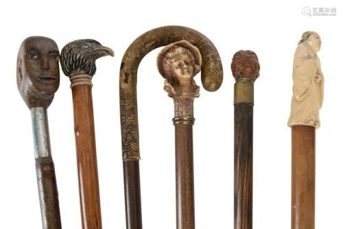 Six walking sticks each with carved novelty handles