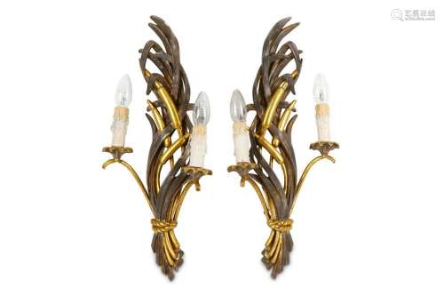 A pair of early 20th Century carved and parcel gilt