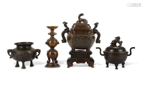 THREE BRONZE INCENSE BURNERS AND A BRONZE CANDLEST