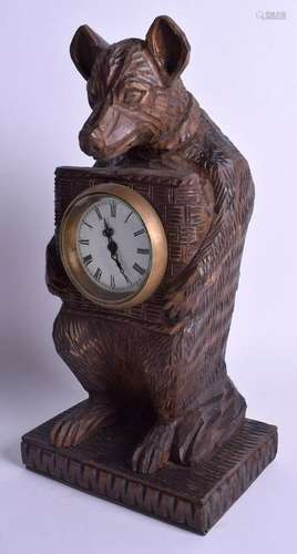 A BLACK FOREST STYLE BEAR MANTEL CLOCK. 30 cm x 15 cm.