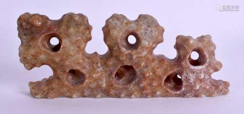 A CHINESE CARVED STONE BRUSH REST. 10 cm wide.