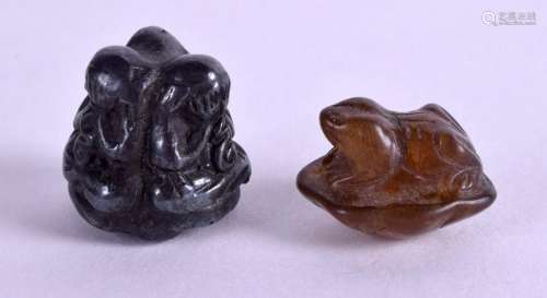 A TIBETAN BRONZE TOGGLE together with another. (2)